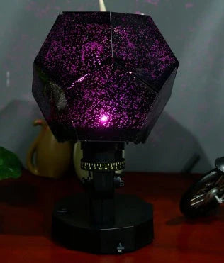 Magical Starlight Projection Lamp casting a mesmerising display of stars and seasonal motifs, creating a serene ambiance in a living room