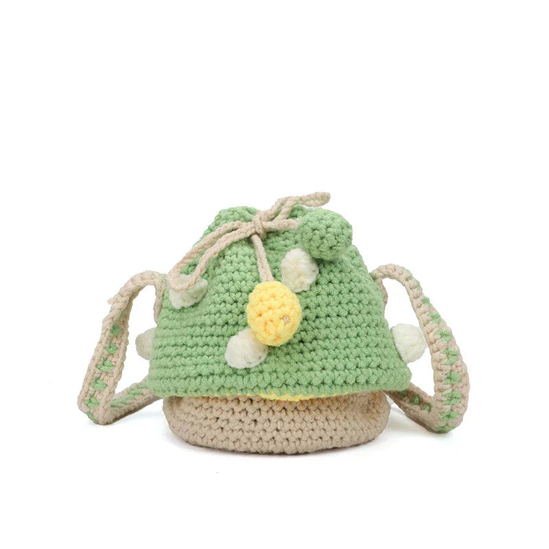 A hand-knitted wool handbag in a classic bucket shape and mini size, featuring premium cotton and linen materials
