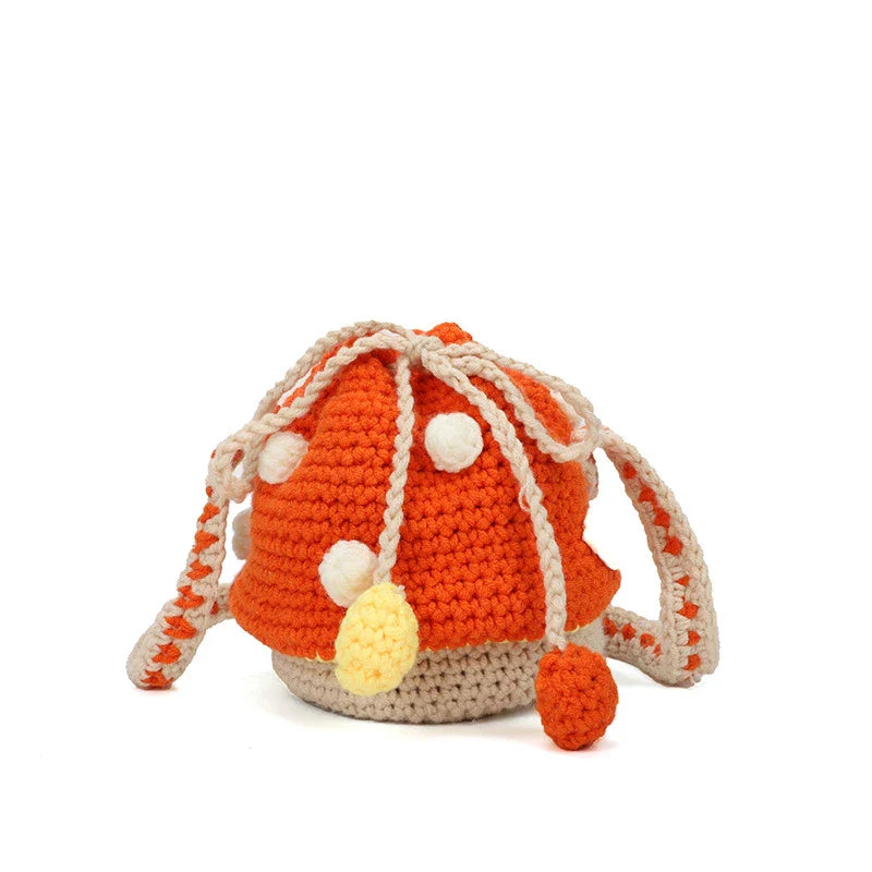 A hand-knitted wool handbag in a classic bucket shape and mini size, featuring premium cotton and linen materials