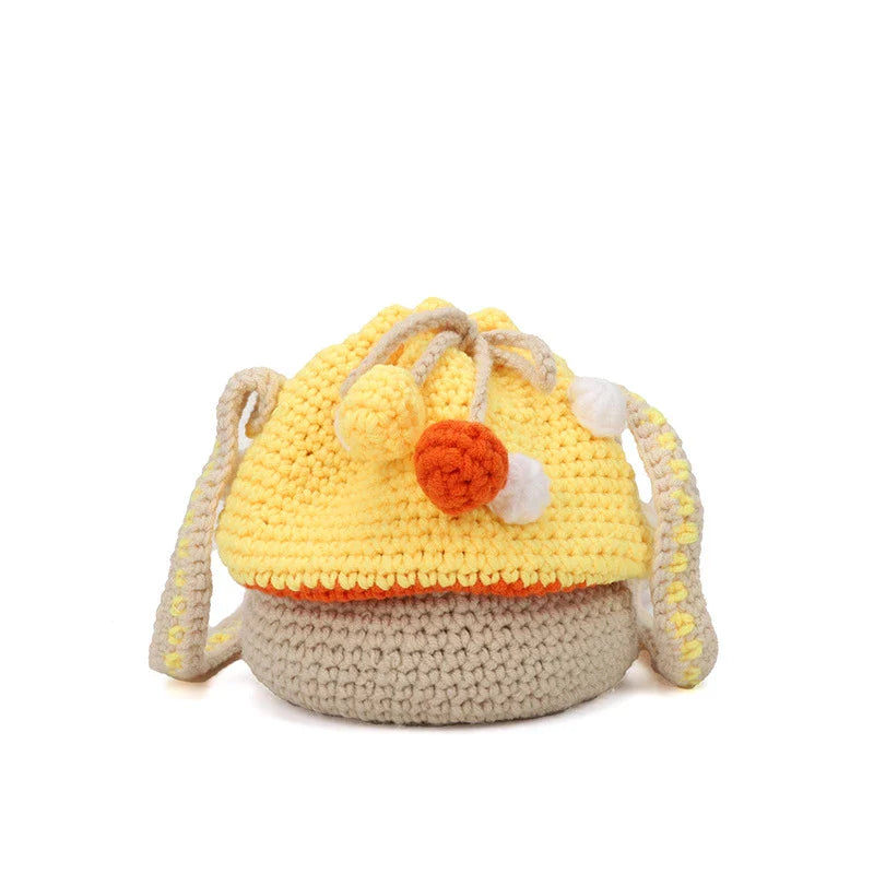 A hand-knitted wool handbag in a classic bucket shape and mini size, featuring premium cotton and linen materials
