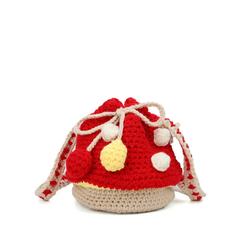A hand-knitted wool handbag in a classic bucket shape and mini size, featuring premium cotton and linen materials