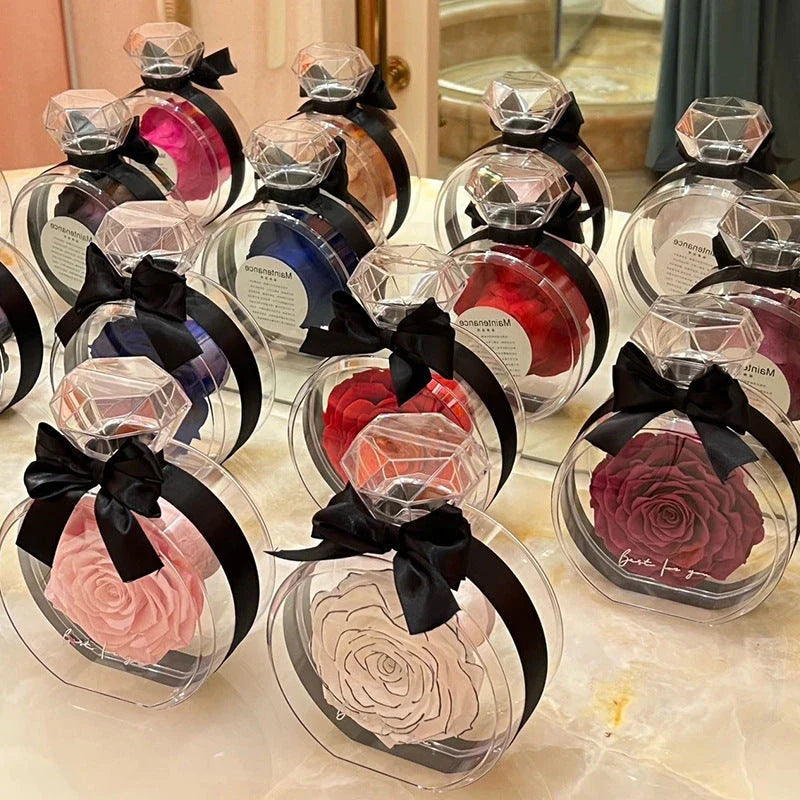 Preserved Rose Flower Ornaments in various colors, including red, pink, plum, and sapphire blue, displayed in a stylish gift box.