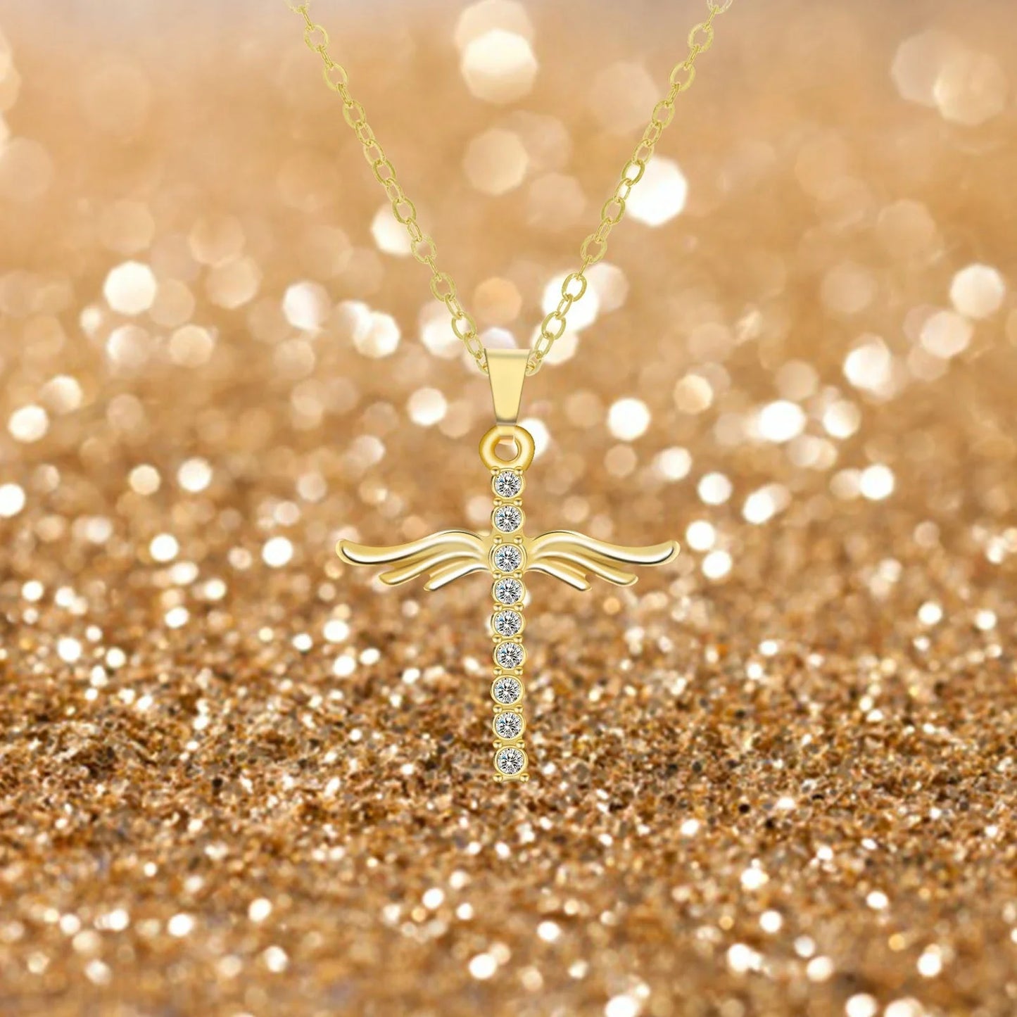 Elegant angel wings cross pendant necklace in silver and gold tones with an adjustable chain