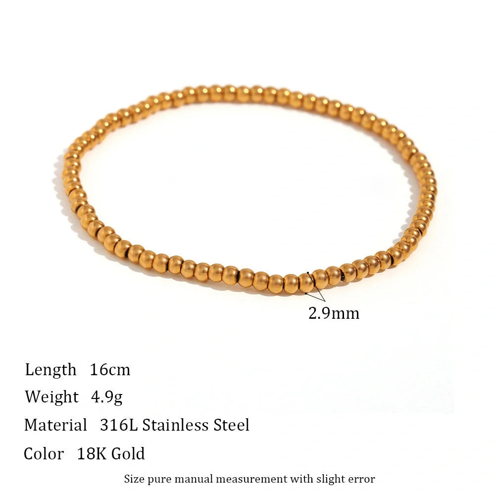 Vintage-inspired stainless steel and 18K plated elastic bead bracelet in a range of sizes and colours