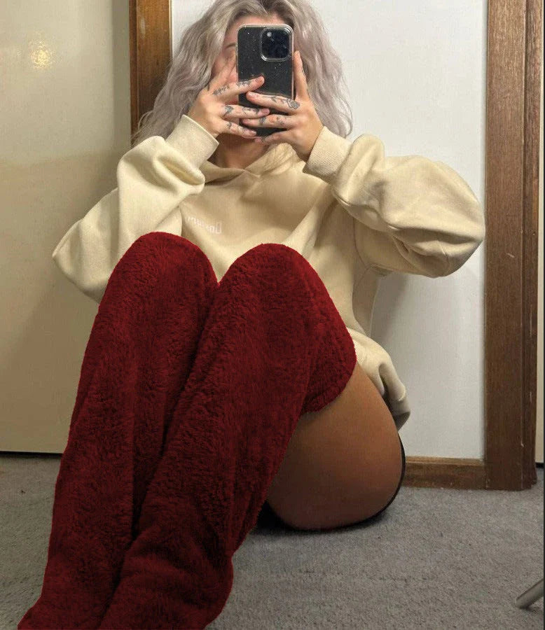 Cozy over-the-knee fuzzy socks in various colors, including brown, blue, dark gray, and pink purple
