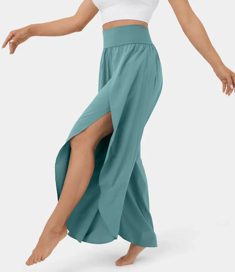 Versatile high-waist split-leg yoga trousers in a variety of colours, featuring a wide-leg silhouette and elasticated waistband for comfort and style.