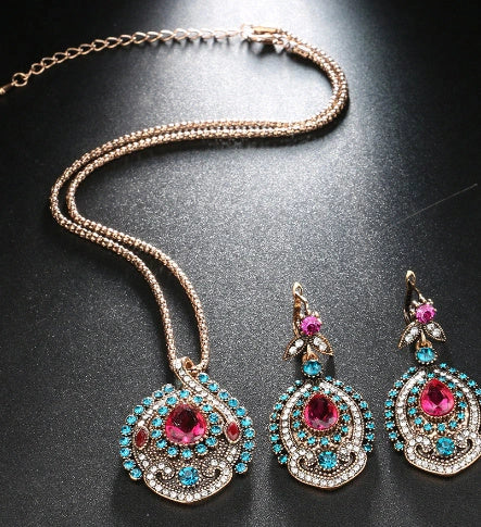 Elegant bohemian-style jewellery set featuring necklaces, earrings, and rings in a variety of colours and sizes
