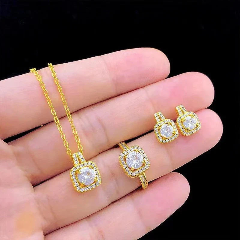Elegant gold-toned jewelry set with zircon gemstone pendant necklace, stud earrings, and statement ring