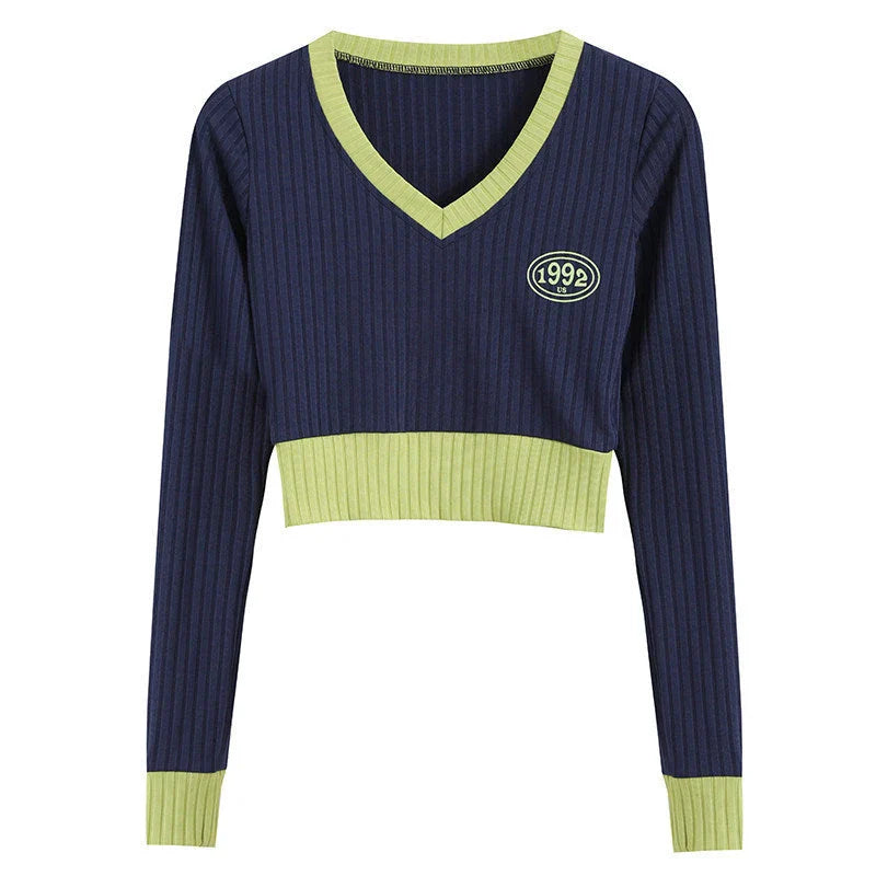 Stylish knitted jumper with V-neck, slim fit, and contrast stitching details