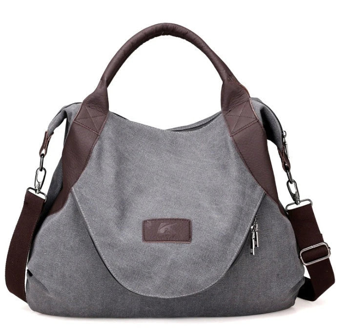 Stylish and versatile canvas shoulder bag with premium brass hardware and thoughtful interior organisation