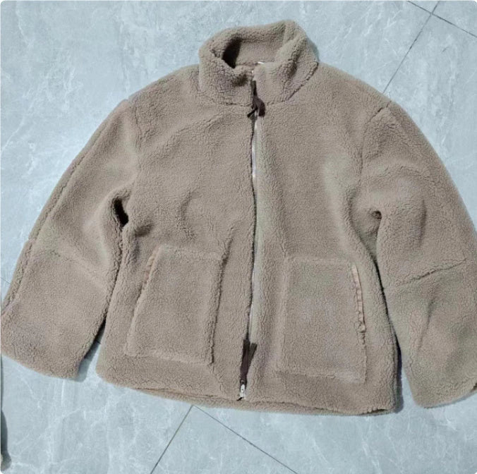 Classic padded fleece jacket in various colours for women, featuring a zip-up design and pockets