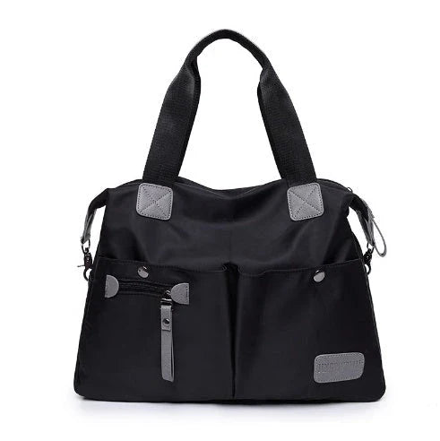 Versatile ladies shoulder bag with multiple carry options, numerous pockets, and durable Oxford fabric construction