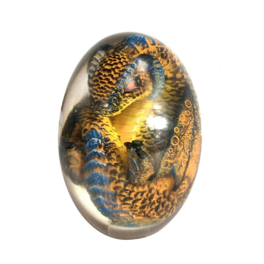 A crystal-clear resin dragon egg decor with a realistic 'lava dragon' design, perfect for fantasy and fossil enthusiasts.