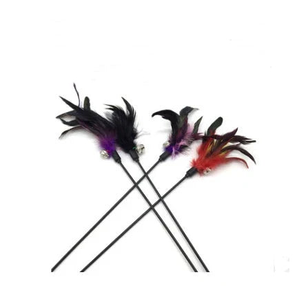 A handcrafted cat toy made from solid wood and natural materials, featuring a feather-on-a-stick design to captivate and engage your feline friend.
