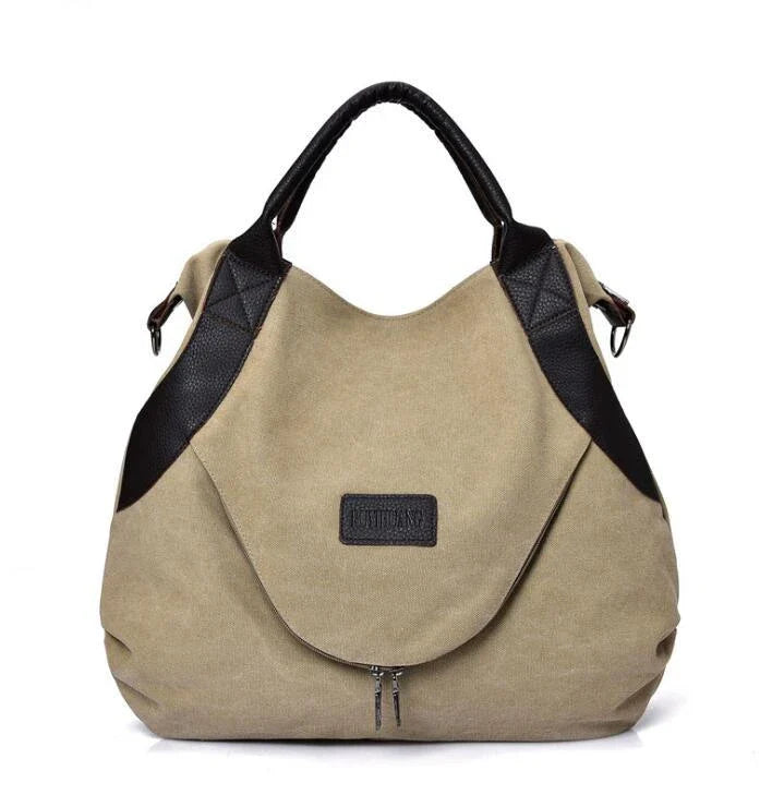 Stylish and versatile canvas shoulder bag with premium brass hardware and thoughtful interior organisation