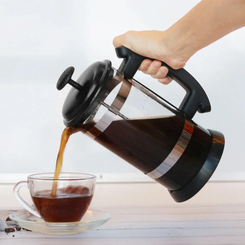 Elegant French press coffee maker in glass and stainless steel, perfect for brewing rich, aromatic coffee at home
