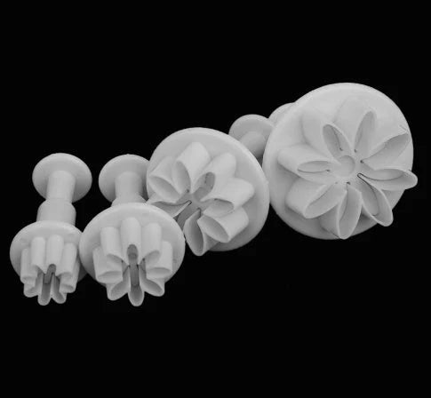 High-quality floral cake decorating tools including molds and cutters for creating intricate desserts