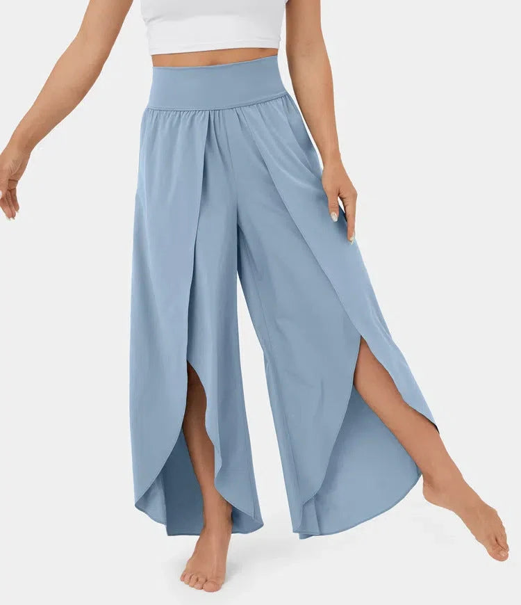Versatile high-waist split-leg yoga trousers in a variety of colours, featuring a wide-leg silhouette and elasticated waistband for comfort and style.