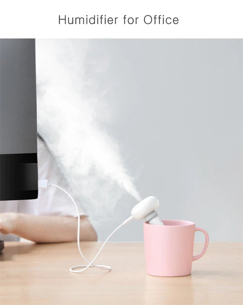 Compact and portable USB-powered air humidifier and essential oil diffuser with versatile water container design