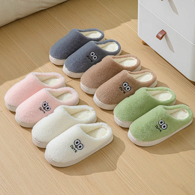 Cozy cartoon-themed slippers for couples, featuring plush material and non-slip rubber soles in a variety of vibrant colors.