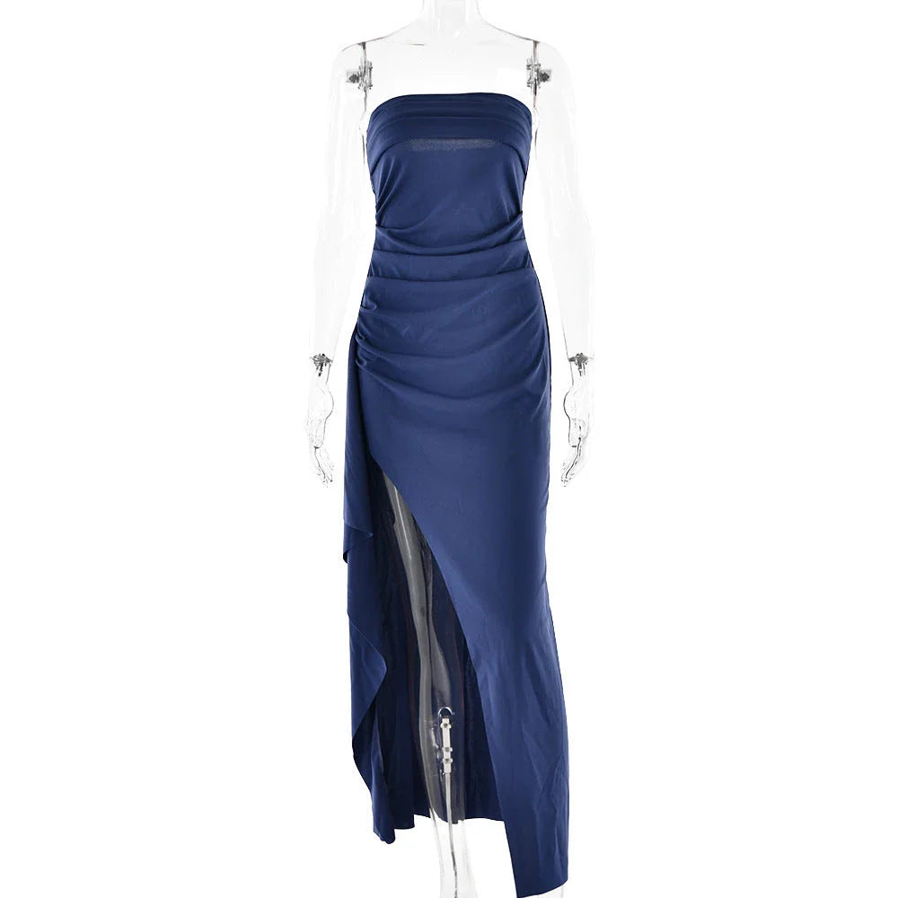 Stunning backless maxi dress in various colors, featuring a pleated A-line skirt and strapless silhouette for elegant occasions.