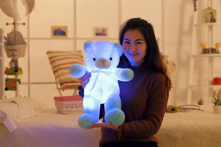 A soft and cuddly teddy bear plush toy with captivating color-changing LED lights, perfect for bringing wonder and delight to a child's room.