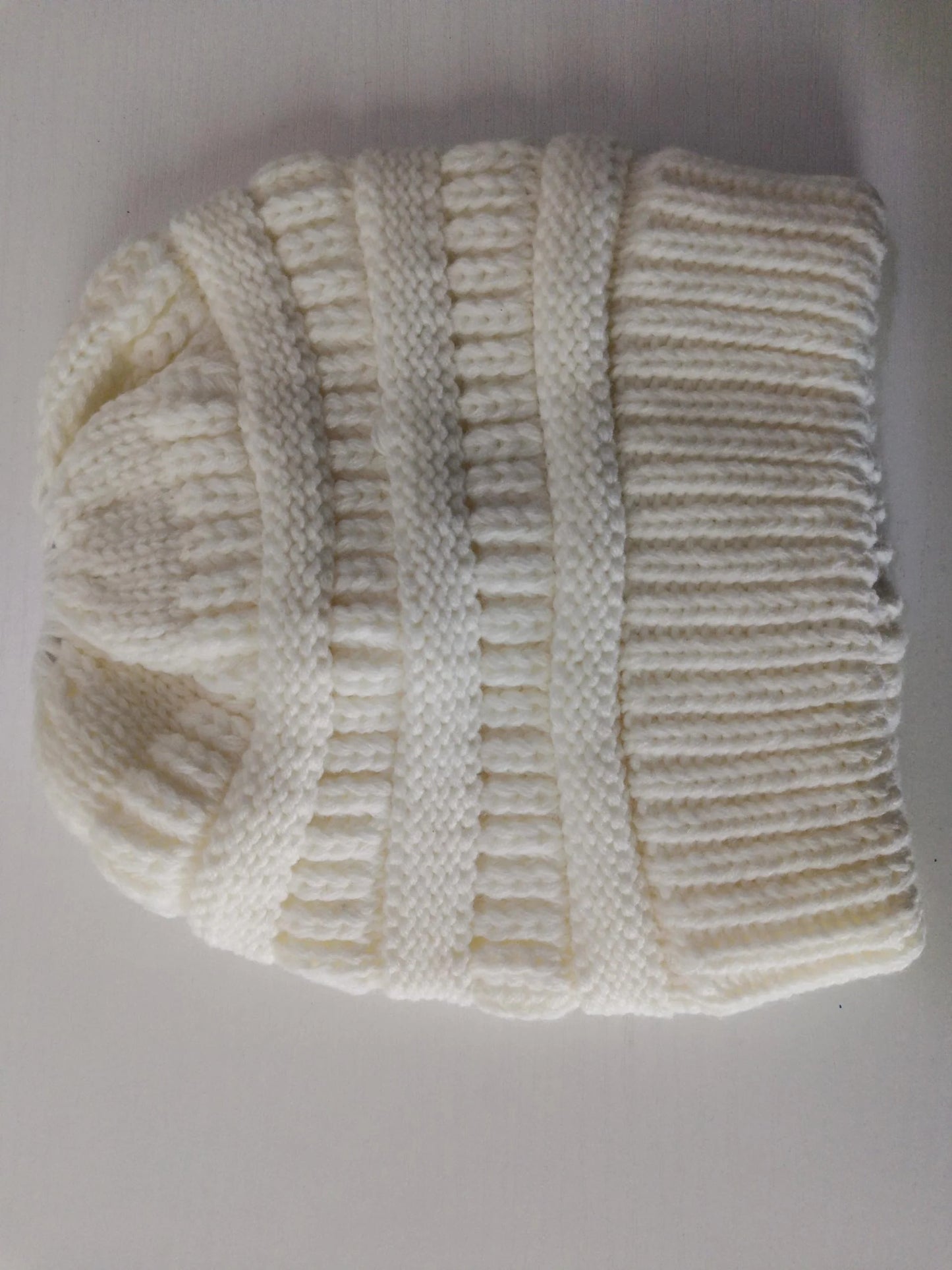 Stylish knitted wool beanie for British ladies with a discreet ponytail hole and a variety of vibrant colour options