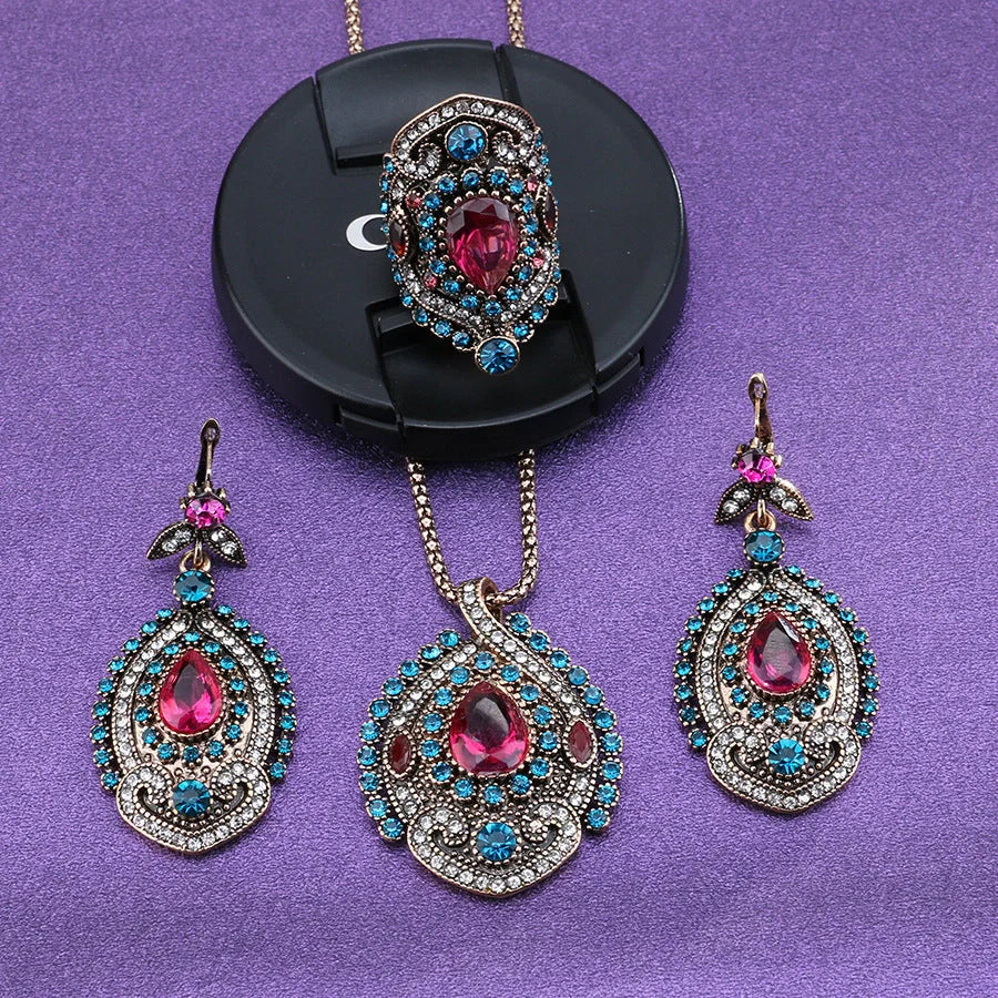 Elegant bohemian-style jewellery set featuring necklaces, earrings, and rings in a variety of colours and sizes
