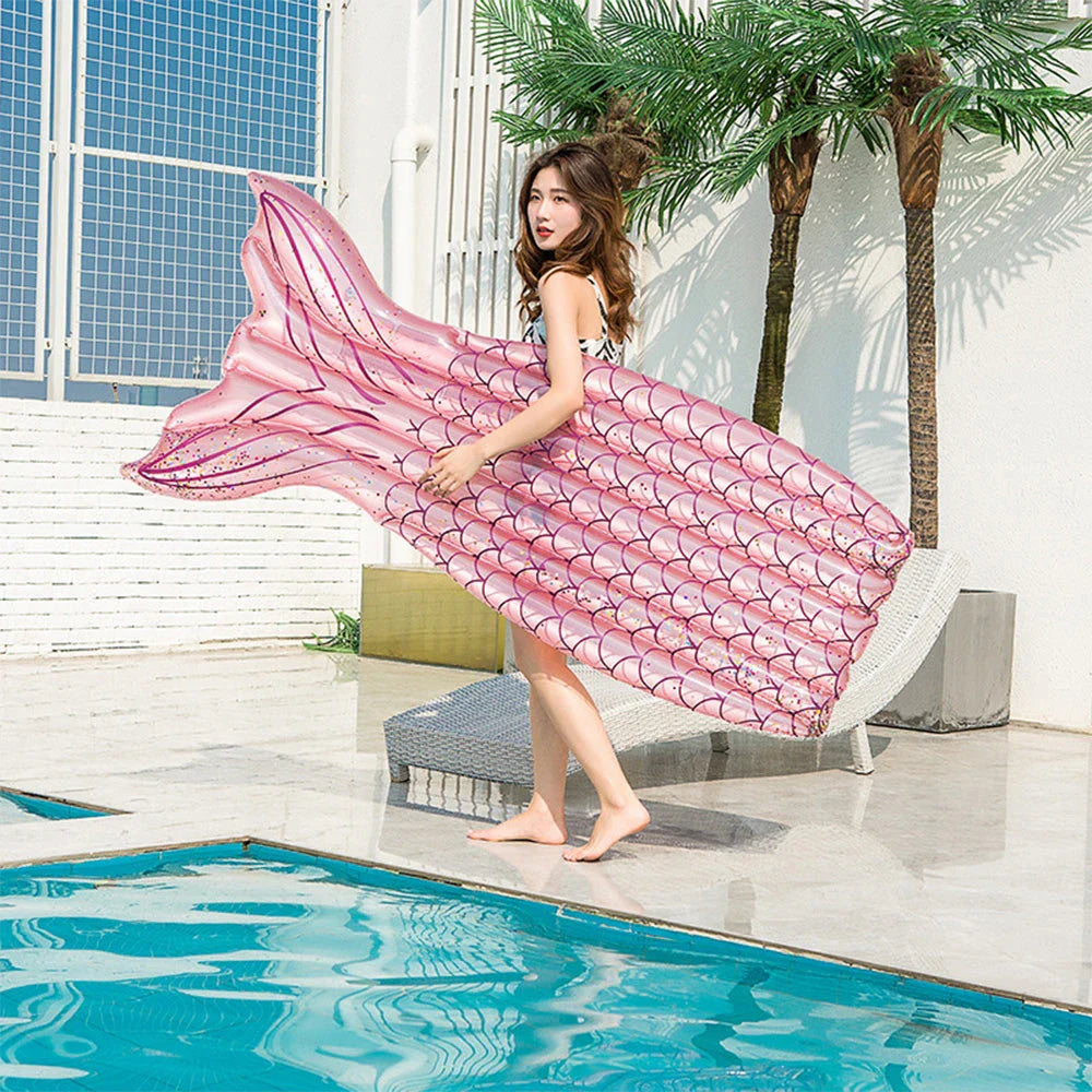 Mermaid-inspired inflatable pool lounger in vibrant blue and pink colours, offering a comfortable and stylish water relaxation experience.