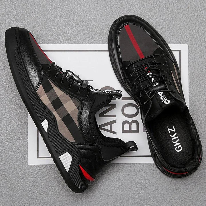 A pair of men's casual leather shoes with a sleek, lace-up design and a stylish check pattern.