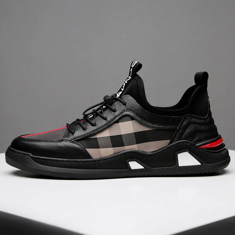 A pair of men's casual leather shoes with a sleek, lace-up design and a stylish check pattern.