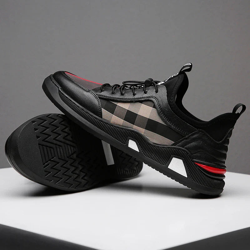 A pair of men's casual leather shoes with a sleek, lace-up design and a stylish check pattern.