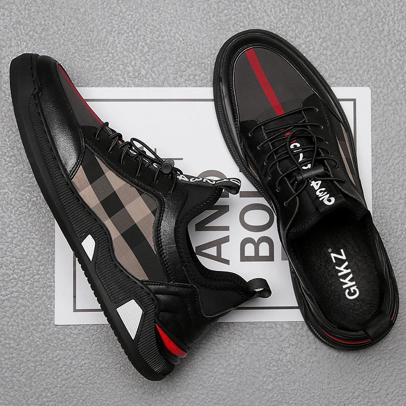 A pair of men's casual leather shoes with a sleek, lace-up design and a stylish check pattern.