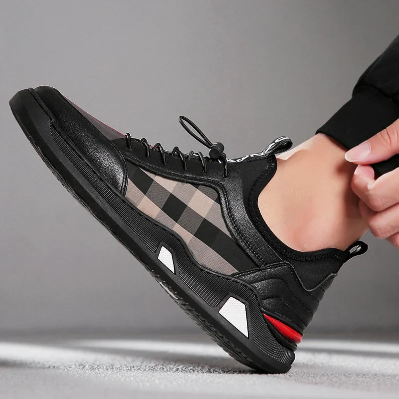 A pair of men's casual leather shoes with a sleek, lace-up design and a stylish check pattern.