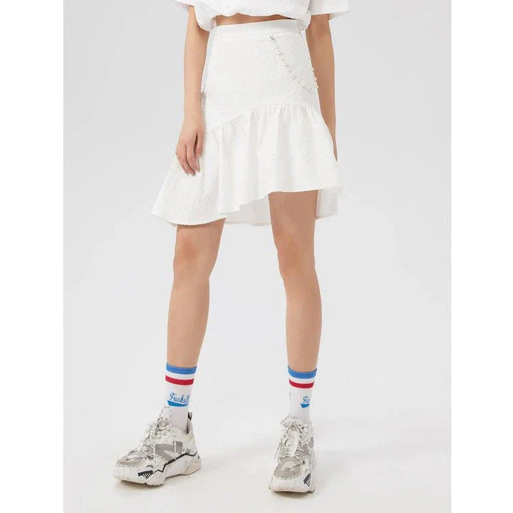 Metersbowne Jacquard Swallowtail Half Skirt Shorts in Black, featuring an embossed fabric design and a flattering silhouette for summer style.