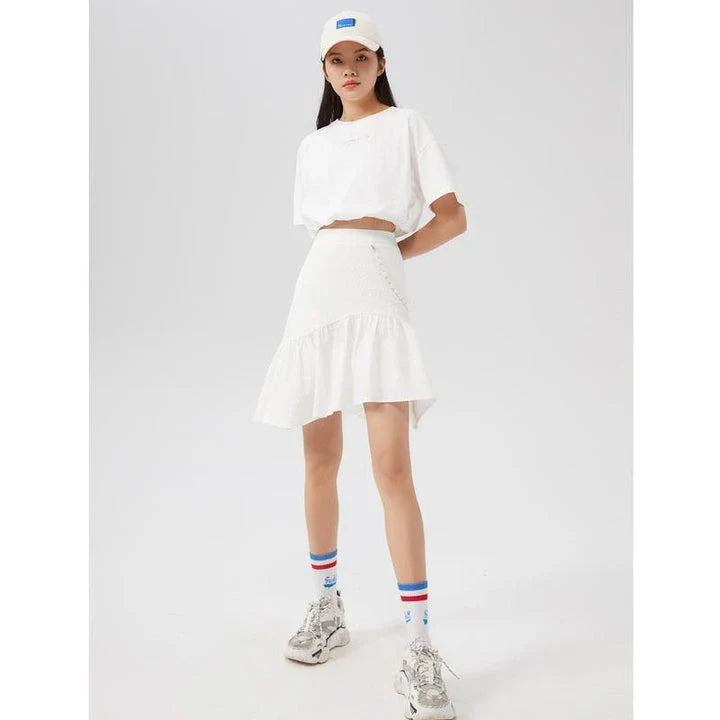 Metersbowne Jacquard Swallowtail Half Skirt Shorts in Black, featuring an embossed fabric design and a flattering silhouette for summer style.