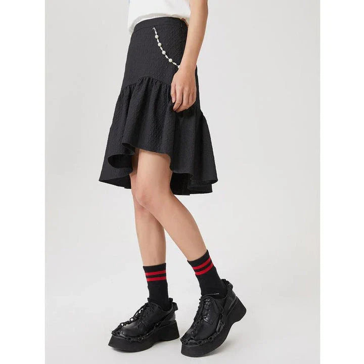 Metersbowne Jacquard Swallowtail Half Skirt Shorts in Black, featuring an embossed fabric design and a flattering silhouette for summer style.