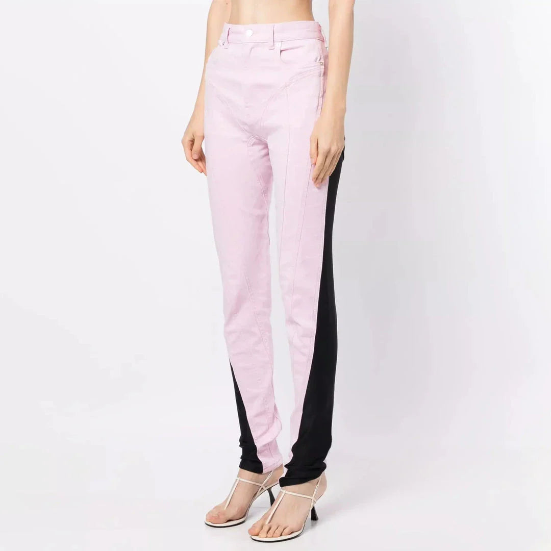 Chic spliced colourblock denim pencil jeans in pink and black, featuring a versatile mid-rise waist and ankle-length cut.