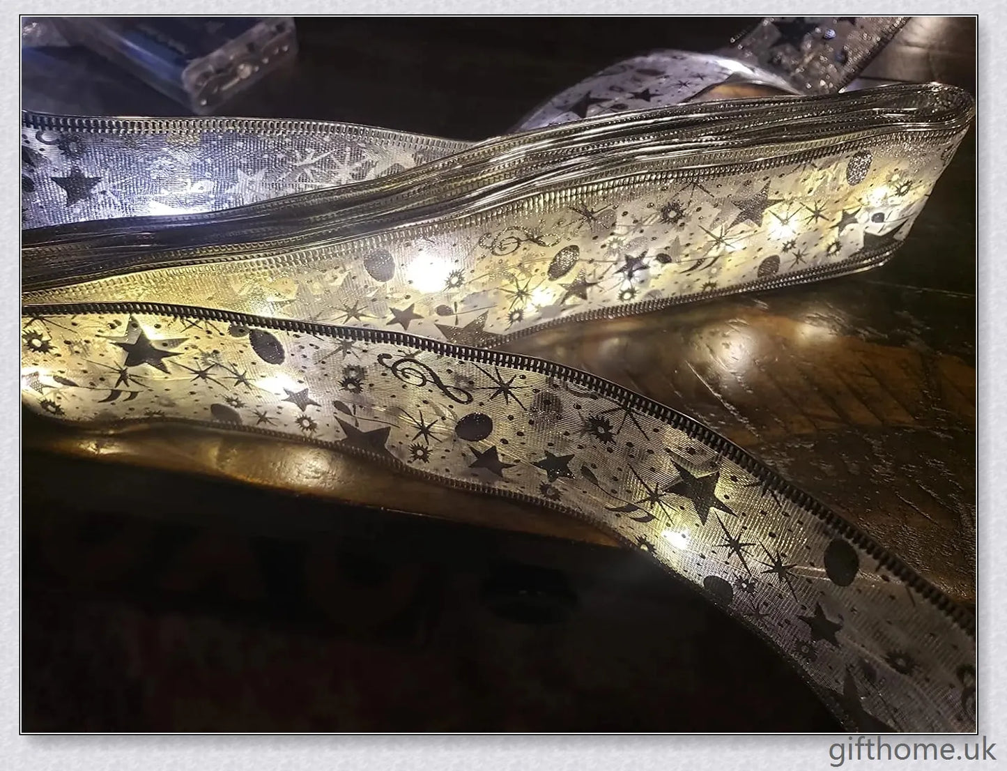 Christmas Ribbon Fairy Lights with warm LED lights, available in gold and silver colours, create a magical holiday ambiance