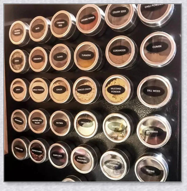Magnetic spice jars with stainless steel canisters, BPA-free lids, and a magnetic rack for easy storage and organization in the kitchen.