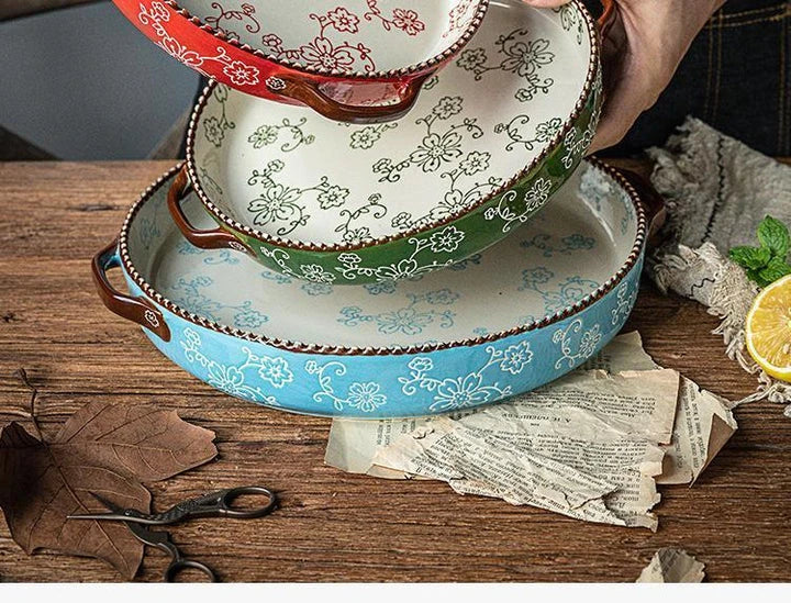 Beautifully hand-painted ceramic baking sheet with a charming cherry blossom design, perfect for even baking and elegant serving.