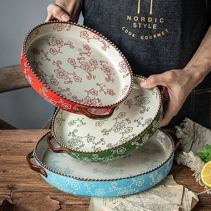 Beautifully hand-painted ceramic baking sheet with a charming cherry blossom design, perfect for even baking and elegant serving.