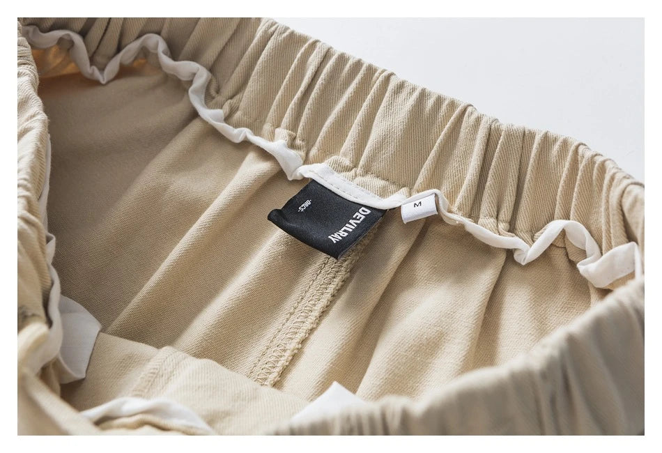 Stylish men's drawstring baggy straight trousers in black and milky white colours