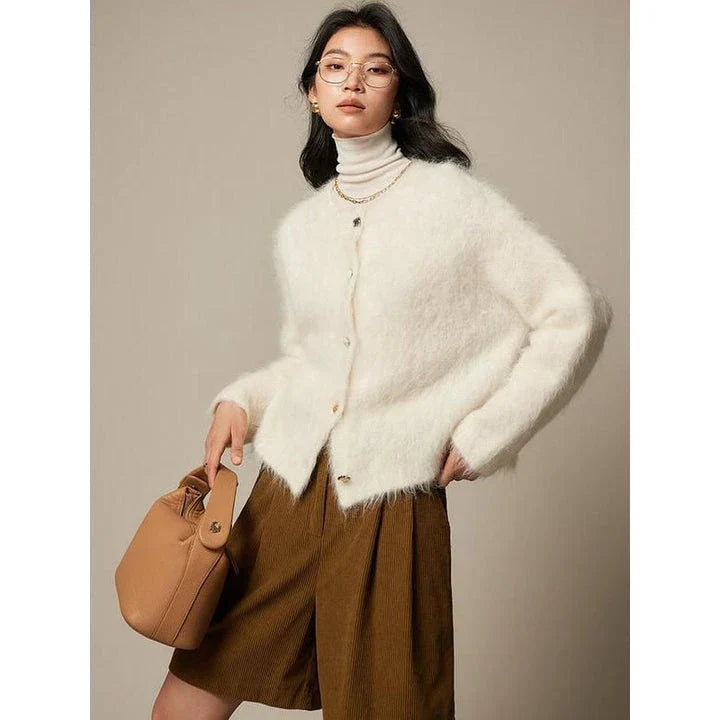 A stylish and cosy alpaca blend cardigan with a sophisticated design, perfect for transitioning between casual and office wear.