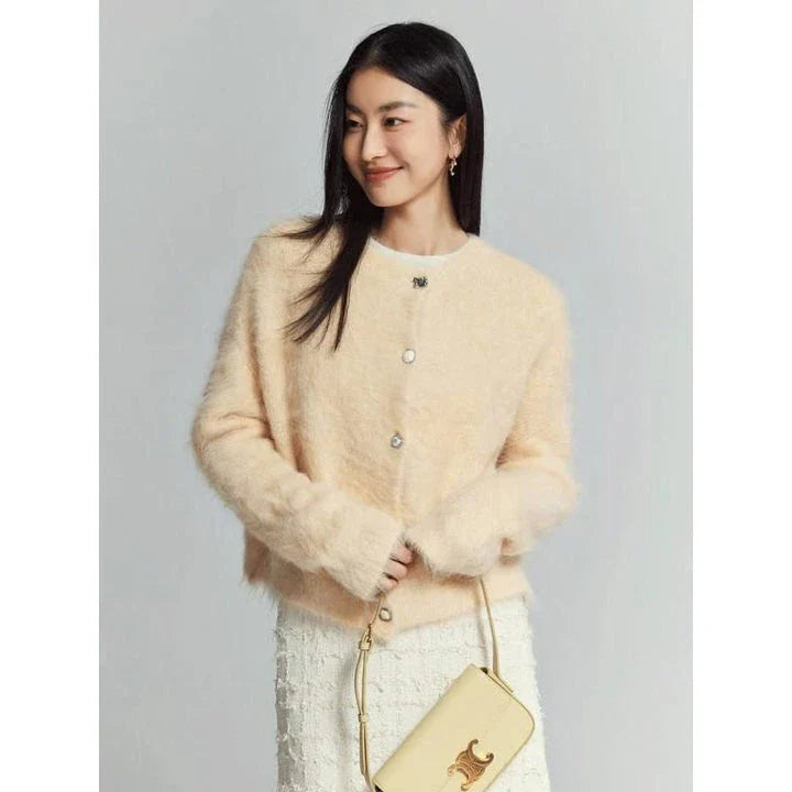 A stylish and cosy alpaca blend cardigan with a sophisticated design, perfect for transitioning between casual and office wear.