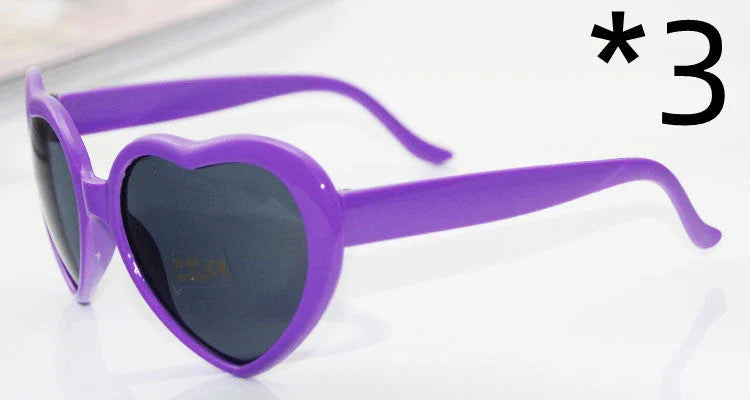 Stylish heart-shaped sunglasses with unique lens design that transforms light into enchanting special effects