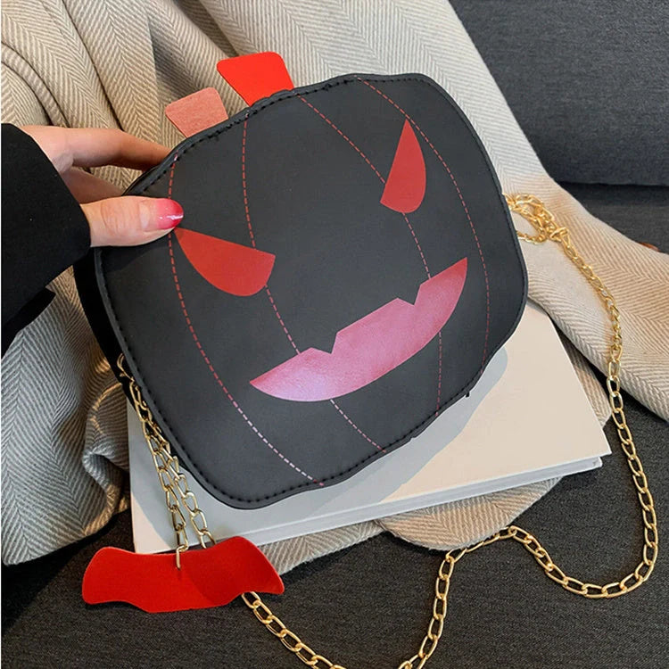 Enchanting Halloween pumpkin-themed shoulder bag in various colours, featuring an adjustable chain strap and trendy urban style