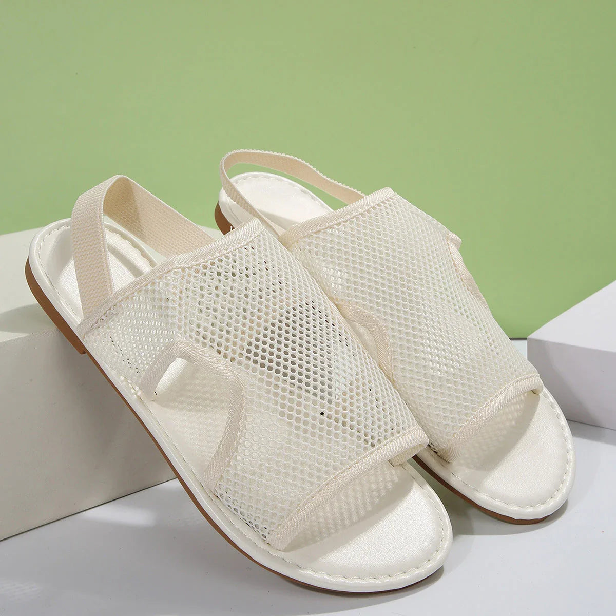 Breathable mesh sandals in various colors, featuring a lightweight design for summer comfort and style