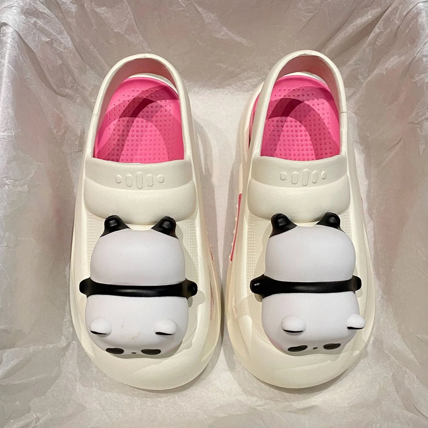 Adorable panda-themed slip-on slippers in various colors and sizes, featuring a lightweight and breathable design for comfortable everyday wear.
