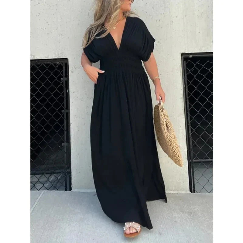 Chic bat-sleeve dress with v-neck, side slit, and elastic waist for comfortable summer style